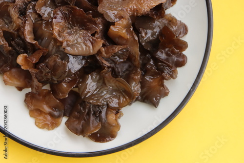 Edible jelly ear mushrooms. Fresh wood ear mushrooms on a plate, ingredient for Asian cuisine