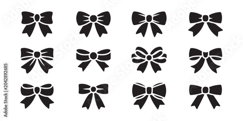Cuadro en lienzo Set of various bow tie and ribbon knot silhouettes isolated on transparent background, black vector