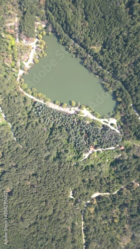 Aerial View of Karagol Lake Surrounded by Dense Green Pine Forest in Izmir Turkey. High quality 4k footage