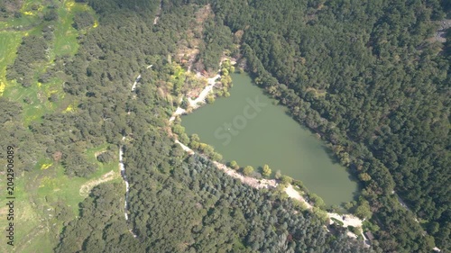 Aerial View of Karagol Lake Surrounded by Dense Green Pine Forest in Izmir Turkey. High quality 4k footage