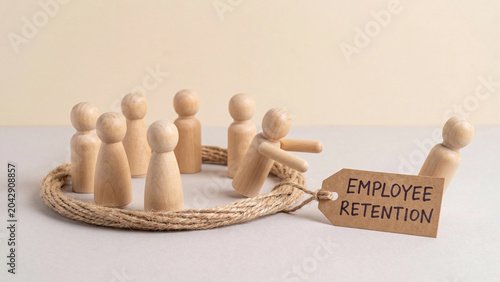 Employee retention concept with wooden peg figurines for human resources team management workforce loyalty and talent strategy