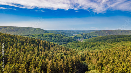 Aerial drone view of Ardennes mountains nature landscape from above, hills and green forest on summer