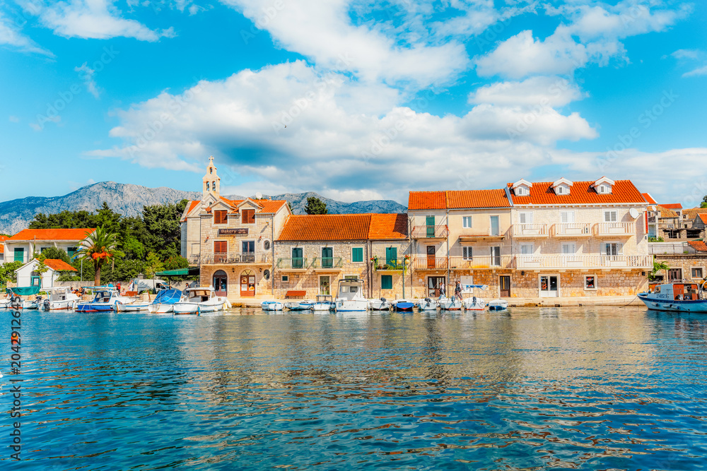 Obraz premium Fishing village of Sucuraj on Hvar island, traditional stone houses, a peaceful harbor and blue Adriatic sea, Croatia.