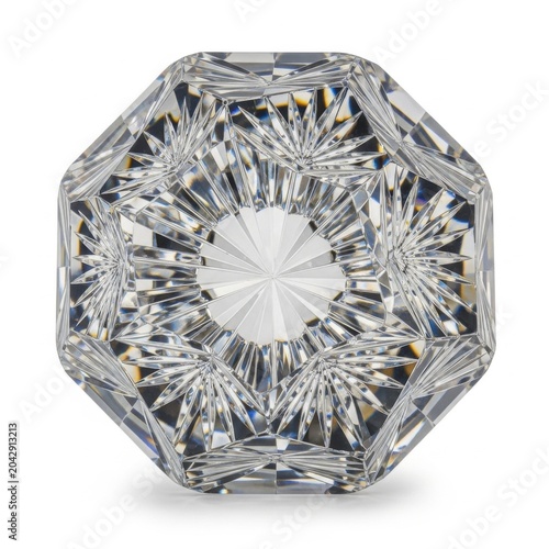 Clear cut crystal glass paperweight with intricate starburst facets on white background