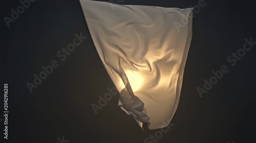 Flowing Fabric Dances in Soft Light Against a Dark Background During a Creative Art Display