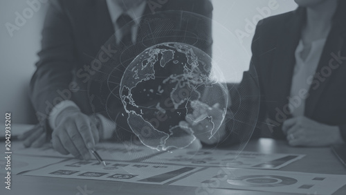 фотографія The concept of a group of business people meeting and a global network