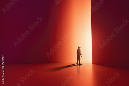 Man Standing in Dramatic Light Between Red Walls . Concept of Op
