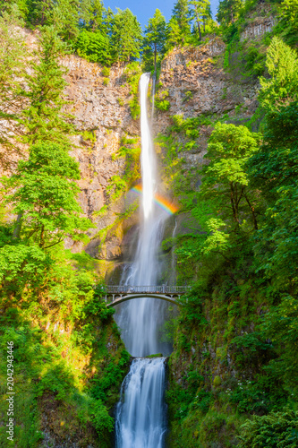 Multnomah Falls Bridge with American Flag in Lush Oregon Forest