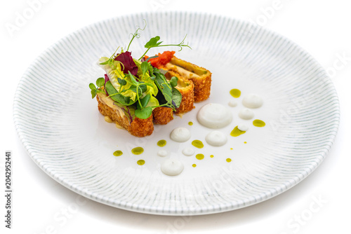 Gourmet seafood dish elegantly plated with micro greens decoration