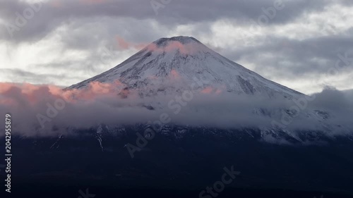 Volcano peak above clouds at sunrise, Chile