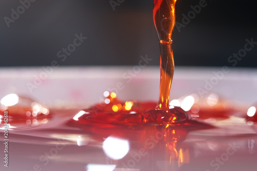 Fotografie Cough syrup is an oral medication formulated to soothe throat irritation, suppre