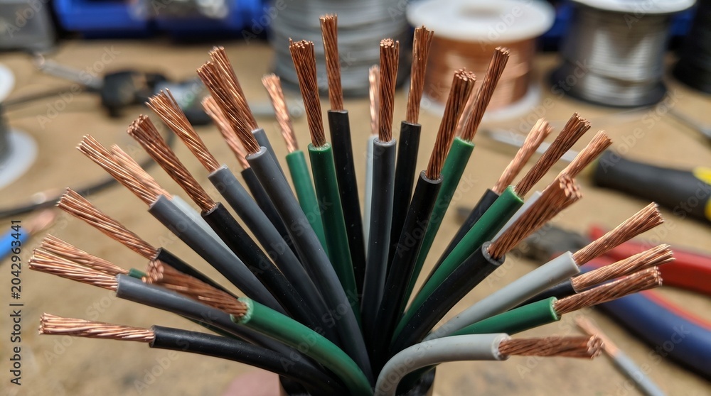 Fototapeta premium Close Up of Stripped Copper Electrical Wires and Cables Industrial Power Connection Concept