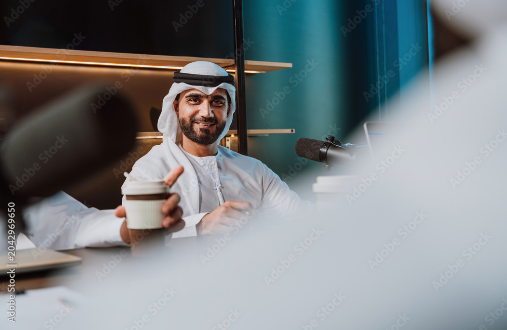 Obraz premium Arab men recording podcast communicating in studio