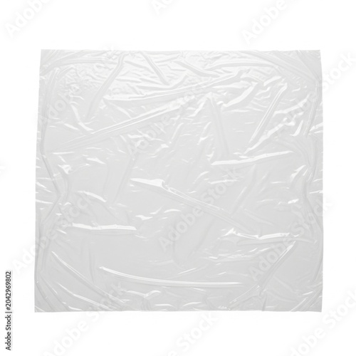 Wrinkled white plastic sheet texture with folds and creases isolated on a white background