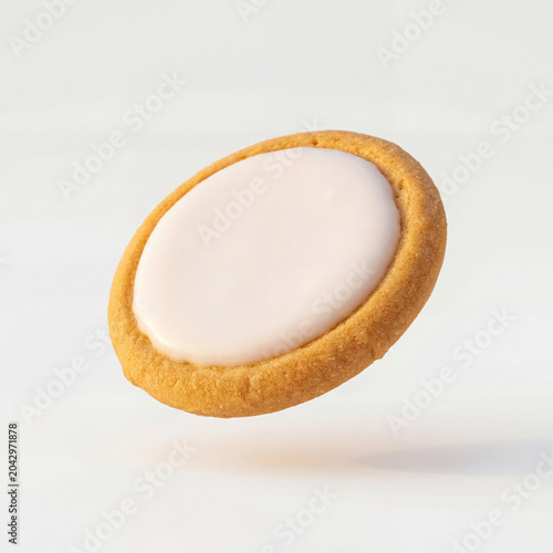 Round Cookie With White Icing On Light Background