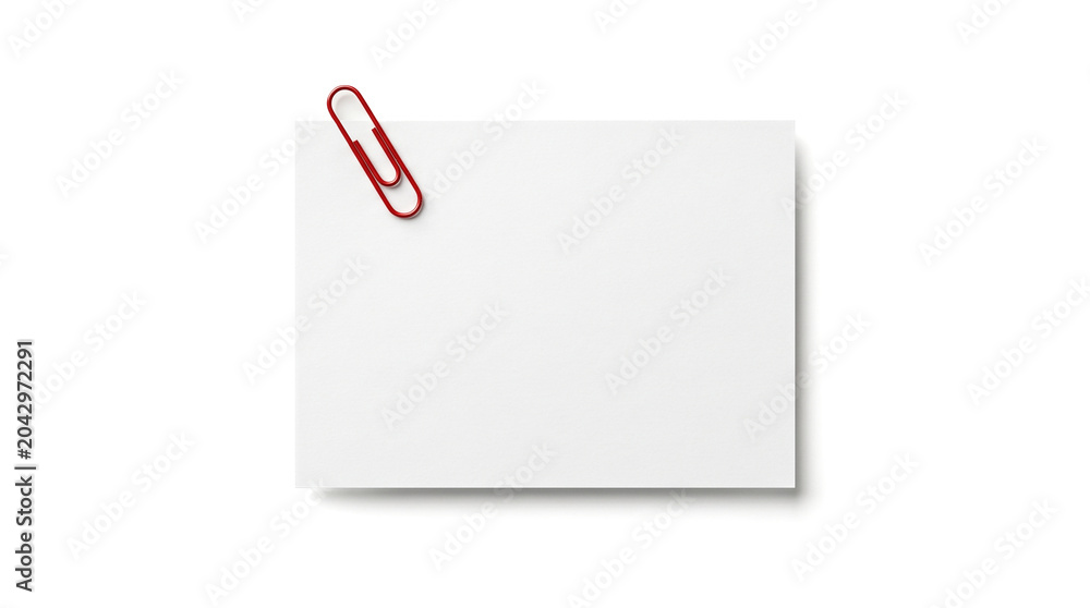 Obraz premium Blank flat rectangular white paper card securely attached with bright red metal paperclip casting soft shadow over plain bright white background