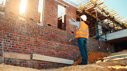 Photos Construction, point and man with building inspection for masonry safety, progress and compliance
