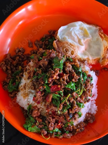 Rice topped with stir-fried pork and basil, Rice topped with stir fried minced pork and basil with Fried egg