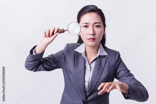 Quadro em tela Businesswoman Holding Magnifying Glass for Investigation and Analysis