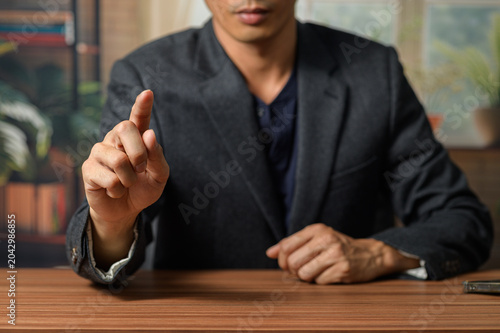 Fotografie Businessman Presenting Gesture in Modern Office Setting