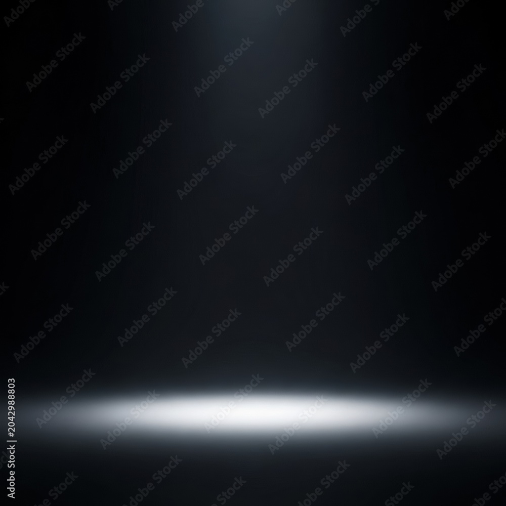 Obraz premium Minimalist dark studio background featuring a single vertical white spotlight beam shining from above onto an empty floor surface, creating a dramatic circular glow for product placement.
