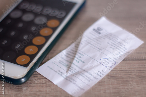 Expense bills and income records used for budgeting financial planning and cost management tasks.