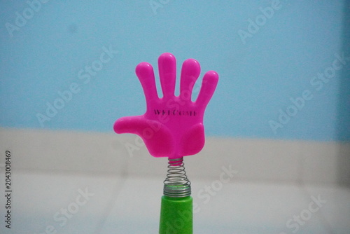 Konstfotografi Mini plastic hand clap toy candy combines playful spring-action clapping fun with sweet confectionery treats