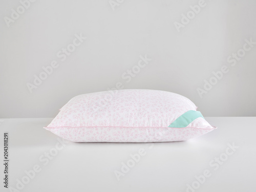Single white pillow isolated on white background, minimal clean composition emphasizing softness, comfort, hygiene, and modern bedding product presentation with simple, elegant aesthetic style.