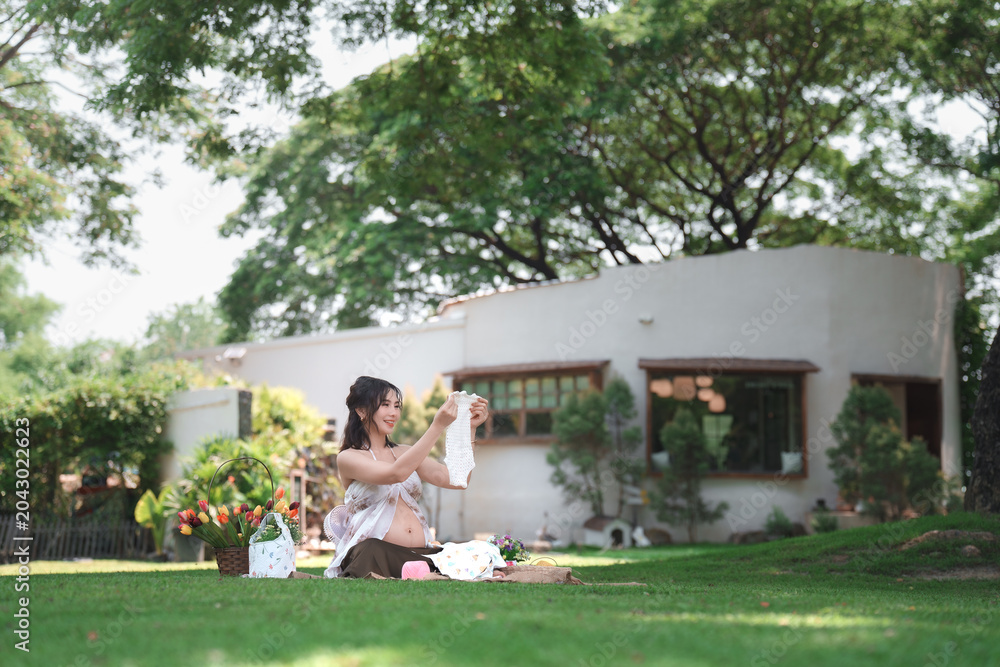 Fototapeta premium Pregnant woman celebrating nature home garden lifestyle photography tranquil setting joyful anticipation