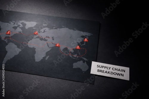 world map illustrating supply chain breakdown with warning markers and red dotted lines