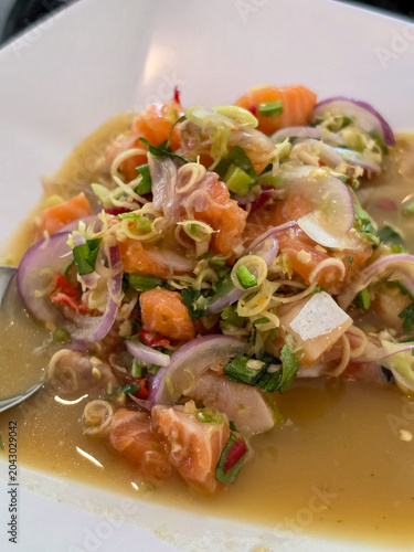 close up of a dish of Asian fusion food: salmon spicy salad