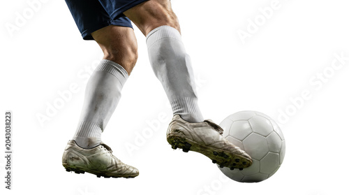 soccer player in uniform kicking ball