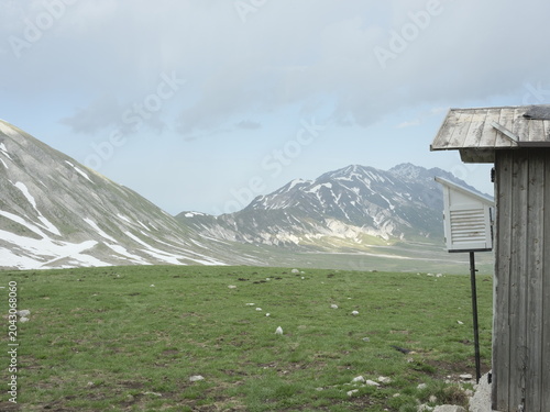 Wooden shepherd shelter in Campo Imperatore beneath the Gran Sasso mountains, Abruzzo, Italy
