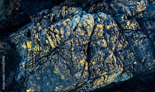 Tableau sur toile Extremely close up of an interesting hard rock texture with rough surface, nature rock pattern of featuring surface pattern highlights background