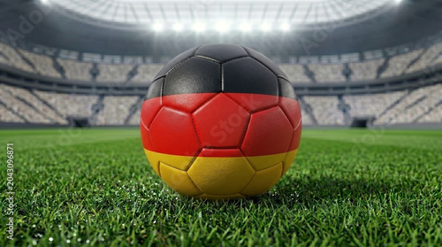 Football on stadium grass with colors of Germany flag