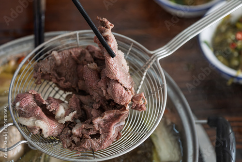 Chaoshan beef hot pot freshly sliced raw beef close up