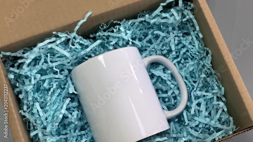 Mug. DIY box. Ceramic mug. Cardboard box. Slow motion video.. High quality 4k footage
