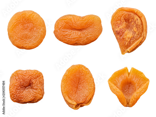 Photos A diverse collection of plump dried apricots, showcasing their natural textures