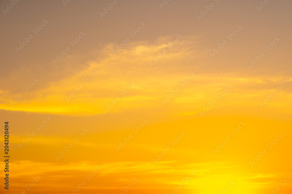 Fototapeta premium Enjoy a panoramic view of the skyline. The sun rises in the morning sky with colorful clouds. and beautiful cloud patterns In the soft light of the morning 