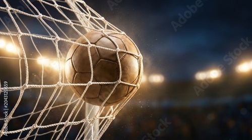 Bilde på lerret Soccer ball hitting the back of the goal net during a night match