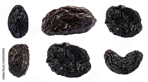Tableau sur toile Close-up photograph of various dried prunes, showcasing their dark, wrinkled texture and glossy finish