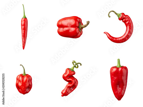 Photos Assortment of fresh red chili peppers in various unique shapes, isolated on a transparent background