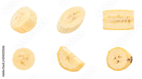 Collection of fresh ripe banana slices and halves, showcasing natural texture on transparent background.