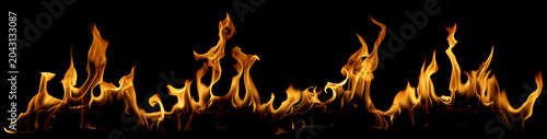 Foto Realistic blazing fire flames isolated on black background, featuring intense he