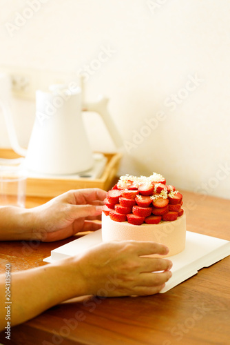 Cake topped with fresh strawberries.