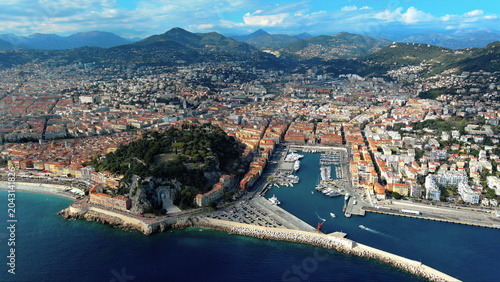 4K aerial drone footage of Nice, France. Beautiful summer cityscape featuring Port Lympia, Castle Hill, and the Mediterranean Sea.