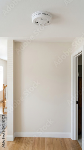 Smoke alarm on ceiling isolated on a clean white background