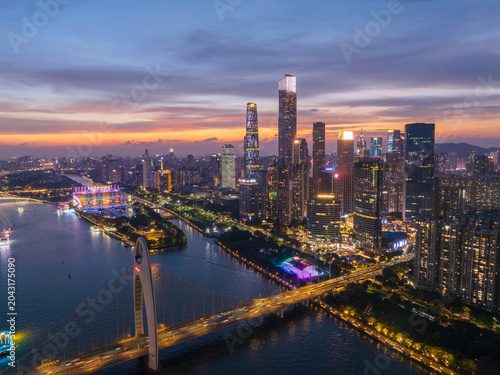 Aerial View of Guangzhou Skyline at Dusk with Illuminated Buildings and River