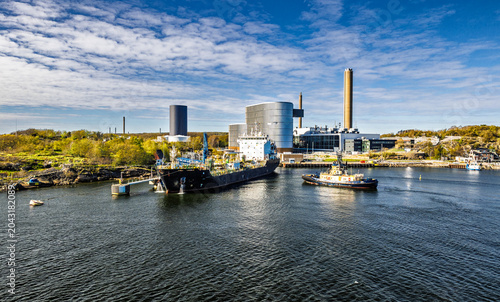 Oil Refinery Storage Tanks and Industrial Waterfront Terminal Along Harbor With Shipping Infrastructure, Gothenburg, Sweden