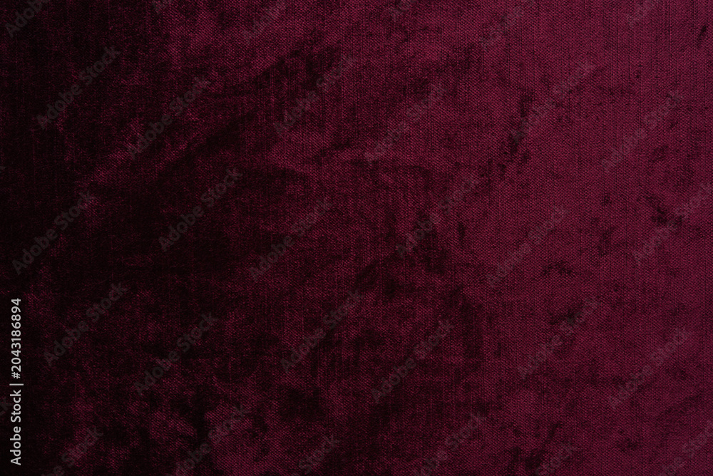 Fototapeta premium Dark red purple crushed velvet texture background, luxury burgundy velour fabric with soft shiny pattern.